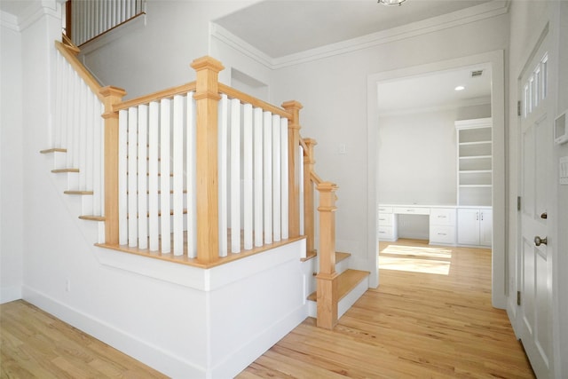 613 E Wall St, Grapevine, TX 76051 - staircase featuring crown molding, wood finished floors, and baseboards