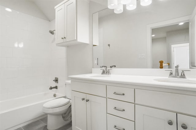 613 E Wall St, Grapevine, TX 76051 - bathroom featuring bathtub / shower combination, a sink, toilet, and double vanity