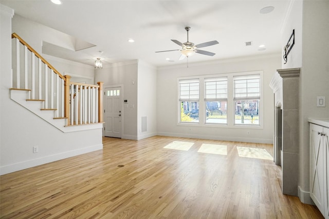 613 E Wall St, Grapevine, TX 76051 - unfurnished living room with crown molding, light wood-style flooring, ceiling fan, and stairway