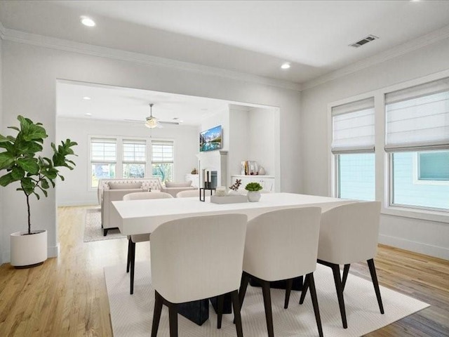 613 E Wall St, Grapevine, TX 76051 - dining space with light wood finished floors, crown molding, recessed lighting, baseboards, and a ceiling fan