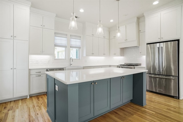 613 E Wall St, Grapevine, TX 76051 - kitchen featuring white cabinetry, a sink, and high quality fridge