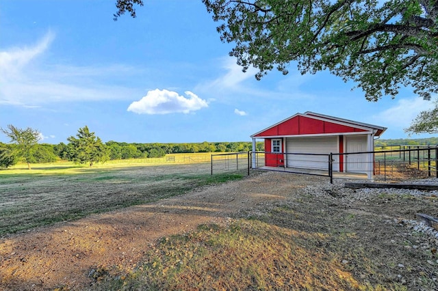 1210 Gordonville Rd, Gordonville, TX 76245 - view of yard with dirt driveway, an outdoor structure, and a rural view