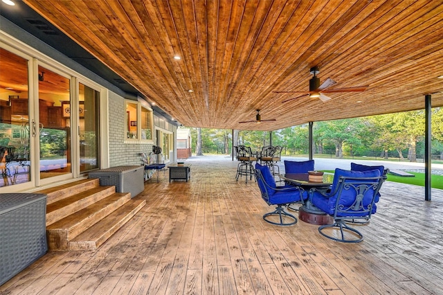 1210 Gordonville Rd, Gordonville, TX 76245 - view of patio / terrace with a wooden deck, outdoor dining area, and a ceiling fan