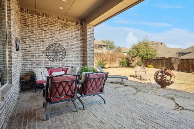 908 Champions Ct, Roanoke, TX 76262 - fenced backyard featuring an outdoor living space and a patio