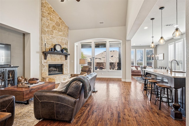 908 Champions Ct, Roanoke, TX 76262 - living room featuring a fireplace, dark wood-style floors, lofted ceiling, and a ceiling fan