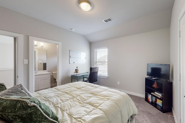 bedroom featuring visible vents, baseboards, ensuite bathroom, carpet, and lofted ceiling
