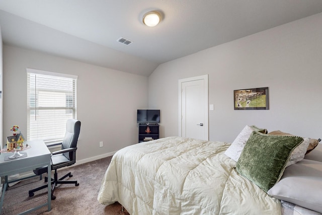 bedroom with visible vents, baseboards, carpet floors, and lofted ceiling