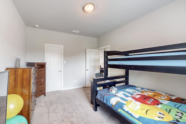 bedroom featuring carpet flooring and visible vents