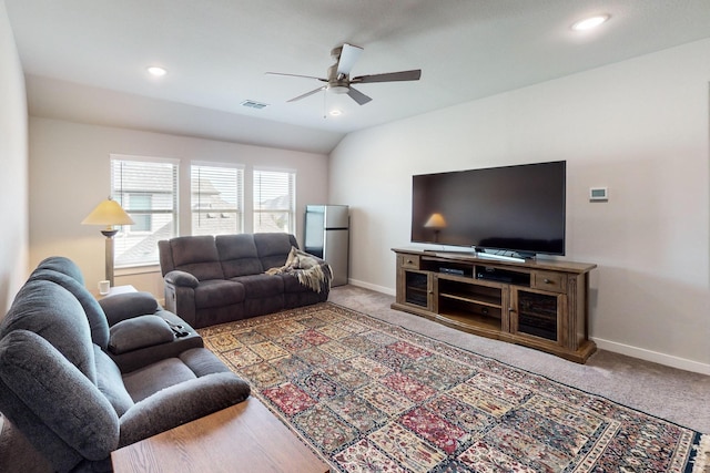 living area with carpet flooring, baseboards, a ceiling fan, and visible vents