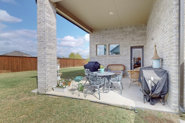 view of patio / terrace with fence and area for grilling