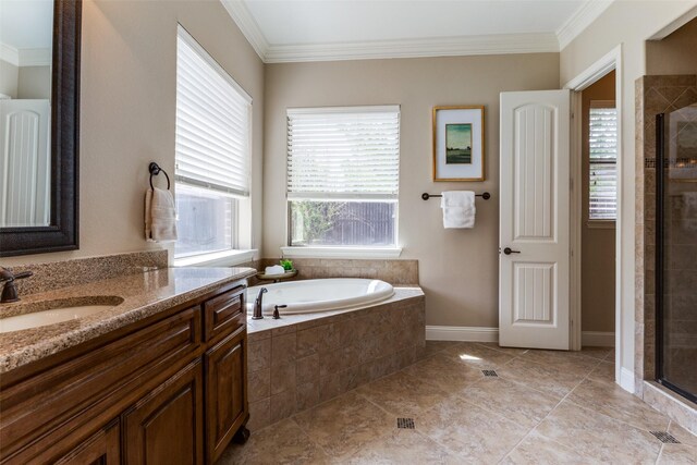 1217 Avondale Dr, Murphy, TX 75094 - bathroom with vanity, a shower stall, ornamental molding, a bath, and tile patterned floors