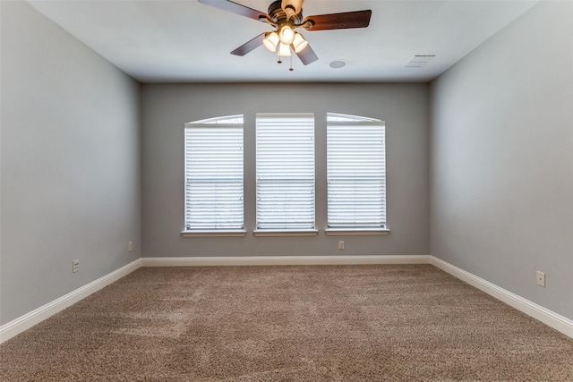 1217 Avondale Dr, Murphy, TX 75094 - carpeted empty room featuring a ceiling fan, healthy amount of natural light, and baseboards