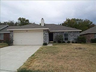 8007 Megan Way, Dallas, TX 75232 - single story home featuring driveway, a garage, a front lawn, and a chimney