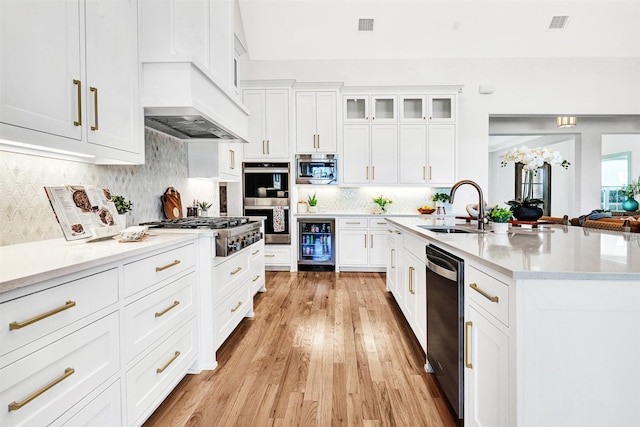 4909 Cheshire Ln, Parker, TX 75002 - kitchen with a sink, beverage cooler, visible vents, appliances with stainless steel finishes, and custom exhaust hood