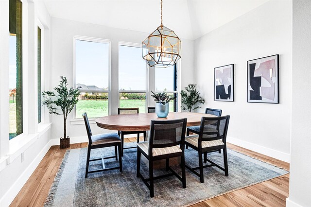 4909 Cheshire Ln, Parker, TX 75002 - dining room with baseboards, wood finished floors, and a notable chandelier