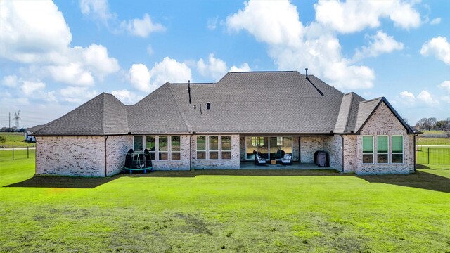 4909 Cheshire Ln, Parker, TX 75002 - back of property featuring roof with shingles, a patio area, brick siding, and a yard