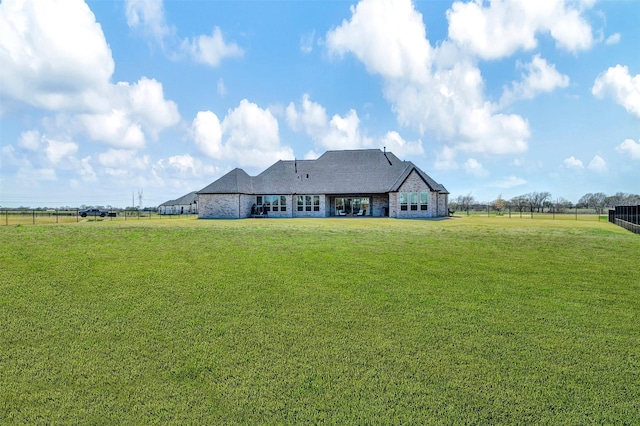 4909 Cheshire Ln, Parker, TX 75002 - rear view of house featuring fence, a yard, and a rural view