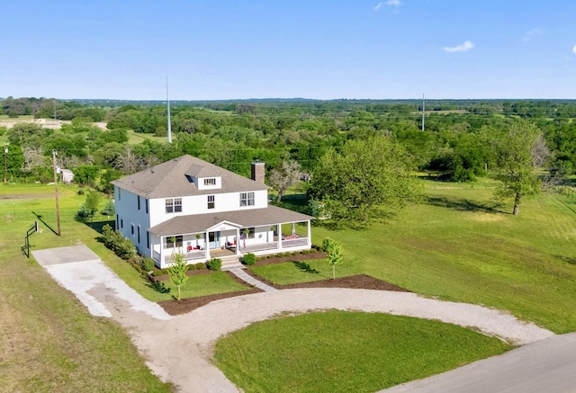 birds eye view of property with a forest view