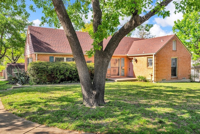7003 Lindsley Ave, Dallas, TX 75223 - view of front facade with a wooden deck, fence, a front lawn, and brick siding