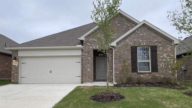 4165 Plateau Dr, Forney, TX 75126 - view of front of home featuring driveway, an attached garage, a front lawn, and brick siding