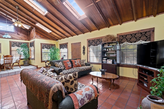 living room with tile patterned floors, a skylight, and a healthy amount of sunlight