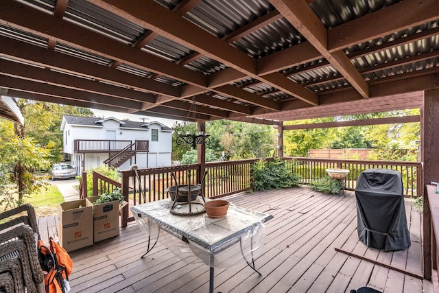 deck featuring an outdoor fire pit and grilling area