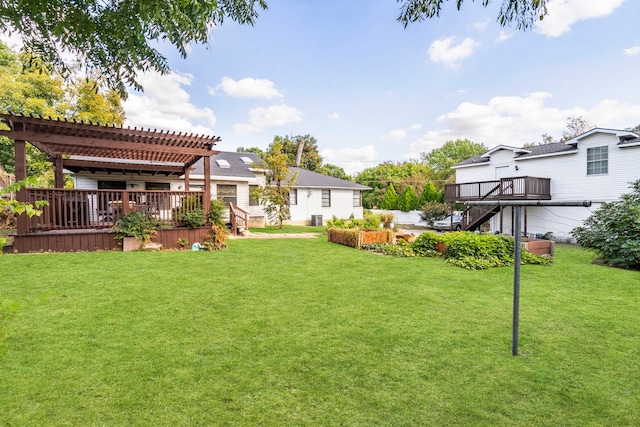 view of yard featuring a deck and a pergola