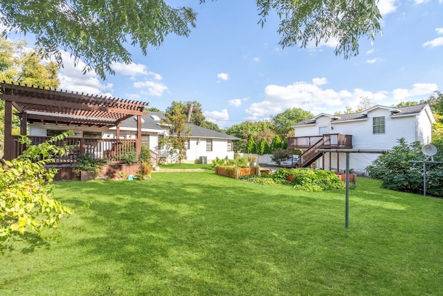 view of yard featuring a wooden deck and a pergola