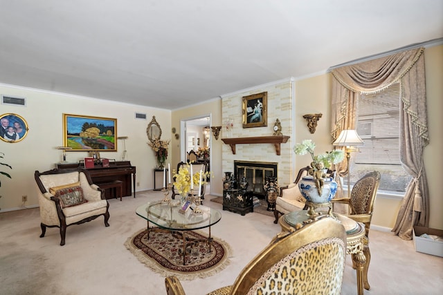 carpeted living room with a large fireplace, crown molding, baseboards, and visible vents