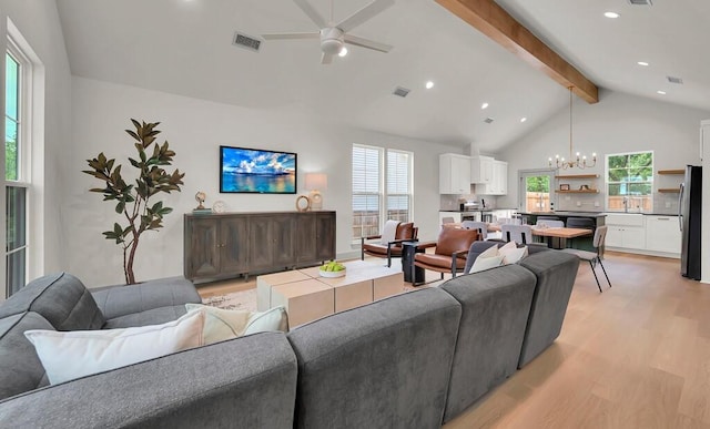 538 Proctor Ave, Waco, TX 76708 - living area with a chandelier, beamed ceiling, light wood finished floors, ceiling fan, and high vaulted ceiling