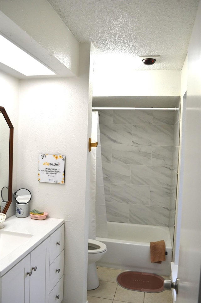 1034 Holland Dr, Garland, TX 75040 - full bathroom featuring vanity, toilet, a textured ceiling, tile patterned floors, and shower / bath combo with shower curtain