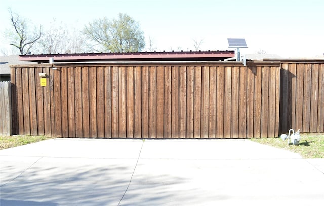 1034 Holland Dr, Garland, TX 75040 - view of gate featuring fence