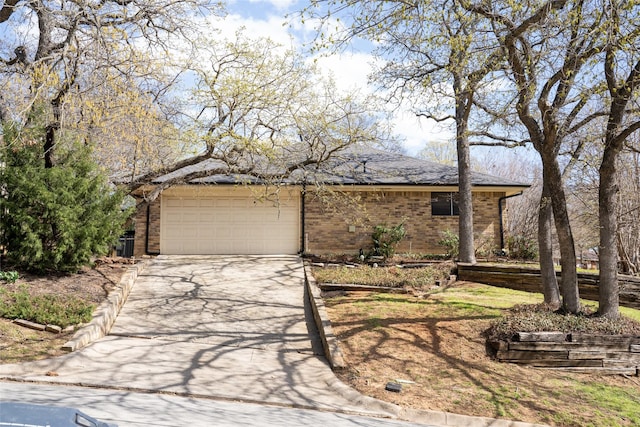 2225 Prestonwood Dr, Arlington, TX 76012 - view of front of house with brick siding, an attached garage, and concrete driveway