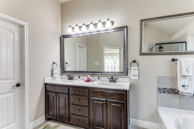 5928 Dunnlevy Dr, Fort Worth, TX 76179 - full bathroom with a sink, baseboards, double vanity, and a garden tub