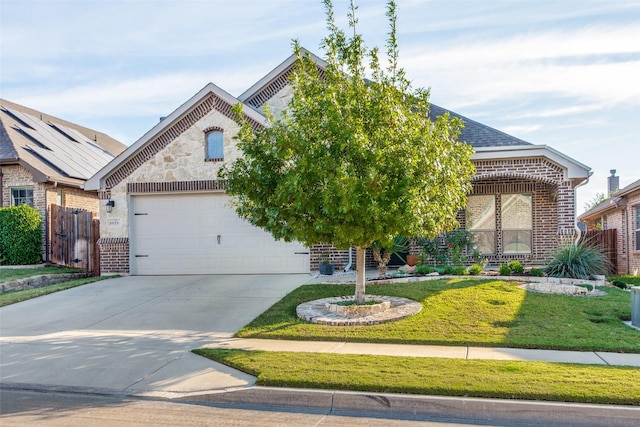 5928 Dunnlevy Dr, Fort Worth, TX 76179 - view of front of property with driveway, a front yard, fence, and brick siding