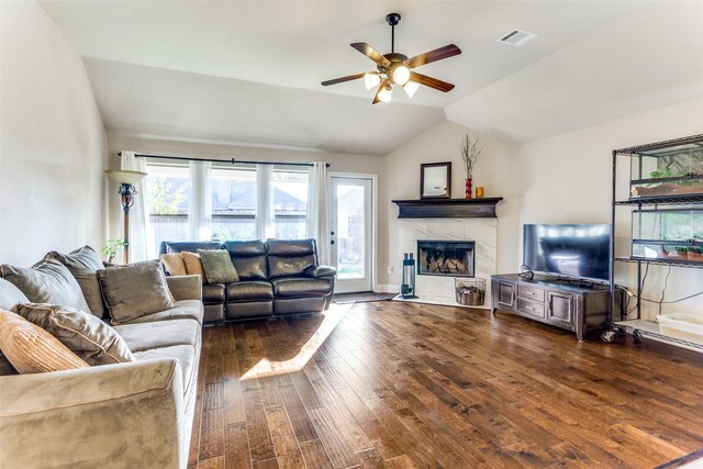 5928 Dunnlevy Dr, Fort Worth, TX 76179 - living room with a tiled fireplace, dark wood-style flooring, a ceiling fan, and lofted ceiling