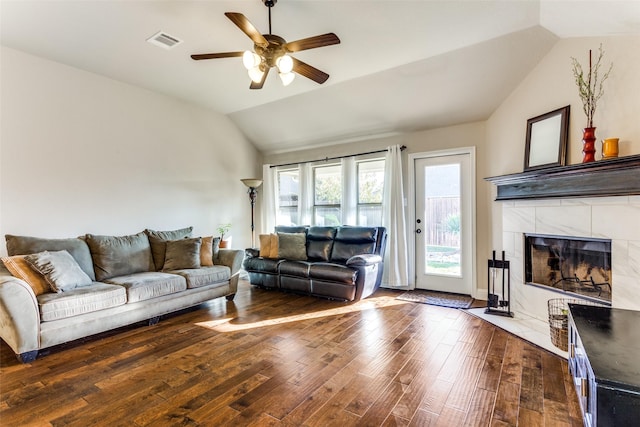 5928 Dunnlevy Dr, Fort Worth, TX 76179 - living room featuring vaulted ceiling, a fireplace, visible vents, ceiling fan, and hardwood / wood-style flooring
