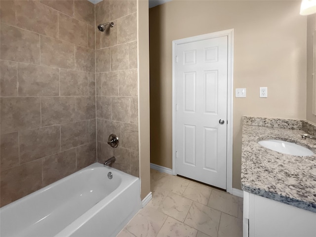 bathroom featuring baseboards, marble finish floor, bathtub / shower combination, and vanity