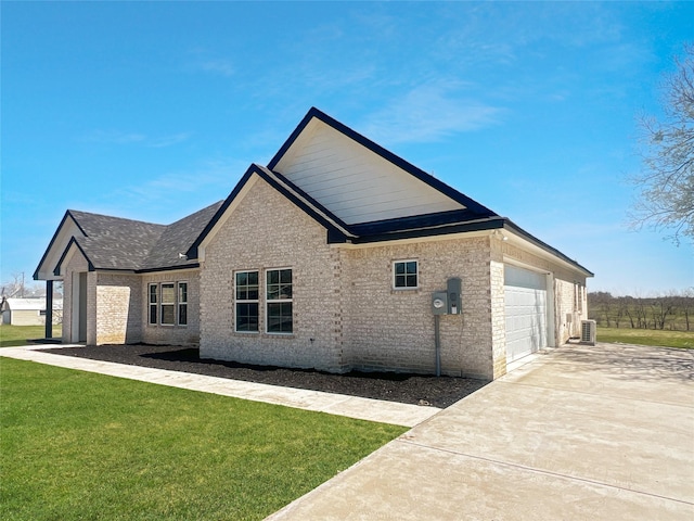 exterior space featuring brick siding, driveway, an attached garage, and a lawn