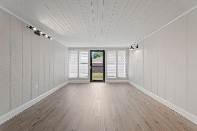 1206 Mayapple Dr, Garland, TX 75043 - unfurnished room featuring baseboards and wood finished floors