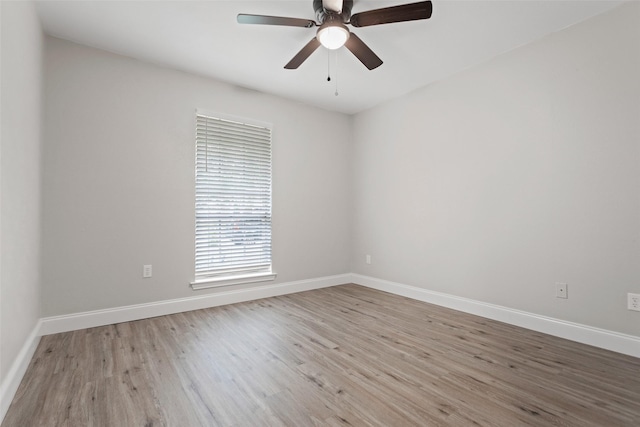 1206 Mayapple Dr, Garland, TX 75043 - unfurnished room with baseboards, ceiling fan, and wood finished floors