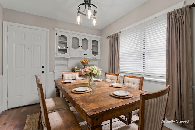 1206 Mayapple Dr, Garland, TX 75043 - dining space featuring dark wood finished floors and a chandelier