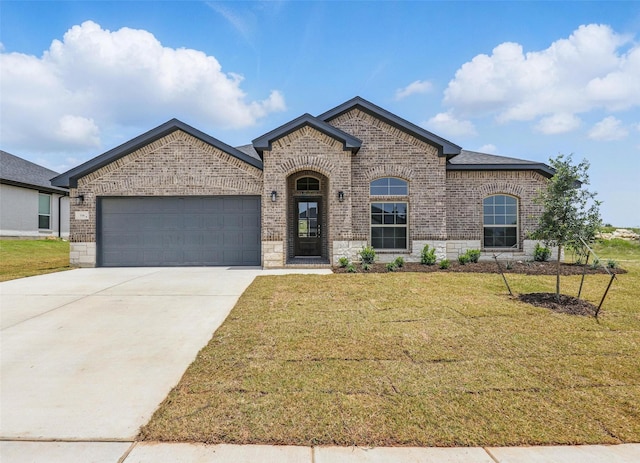 116 Mesa Dr, Glen Rose, TX 76043 - french country inspired facade featuring brick siding, an attached garage, driveway, and a front yard