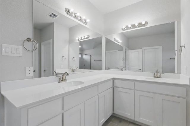 116 Mesa Dr, Glen Rose, TX 76043 - full bathroom with double vanity and tile patterned flooring