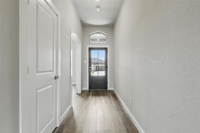 116 Mesa Dr, Glen Rose, TX 76043 - entryway featuring dark wood-type flooring, a textured wall, and baseboards