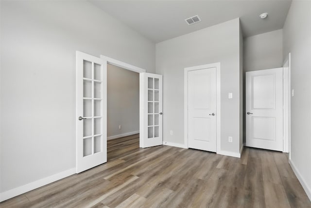 116 Mesa Dr, Glen Rose, TX 76043 - unfurnished bedroom featuring french doors, wood finished floors, and baseboards