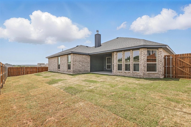 116 Mesa Dr, Glen Rose, TX 76043 - rear view of house with brick siding, a chimney, a patio, and roof with shingles