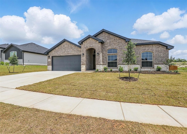 116 Mesa Dr, Glen Rose, TX 76043 - french provincial home featuring brick siding, an attached garage, driveway, and a front yard