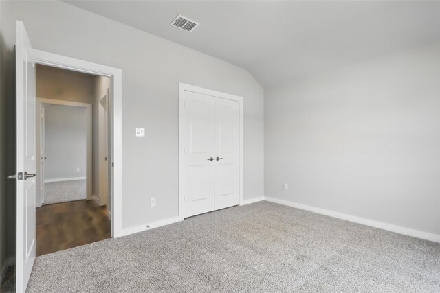 116 Mesa Dr, Glen Rose, TX 76043 - unfurnished bedroom with carpet flooring, baseboards, a closet, and lofted ceiling