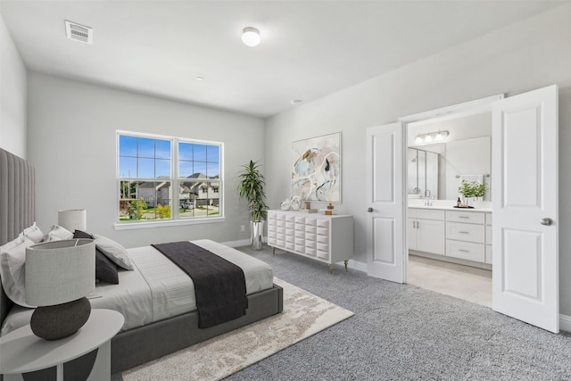 3144 Galveston St, Plano, TX 75075 - bedroom with light colored carpet, ensuite bath, and baseboards